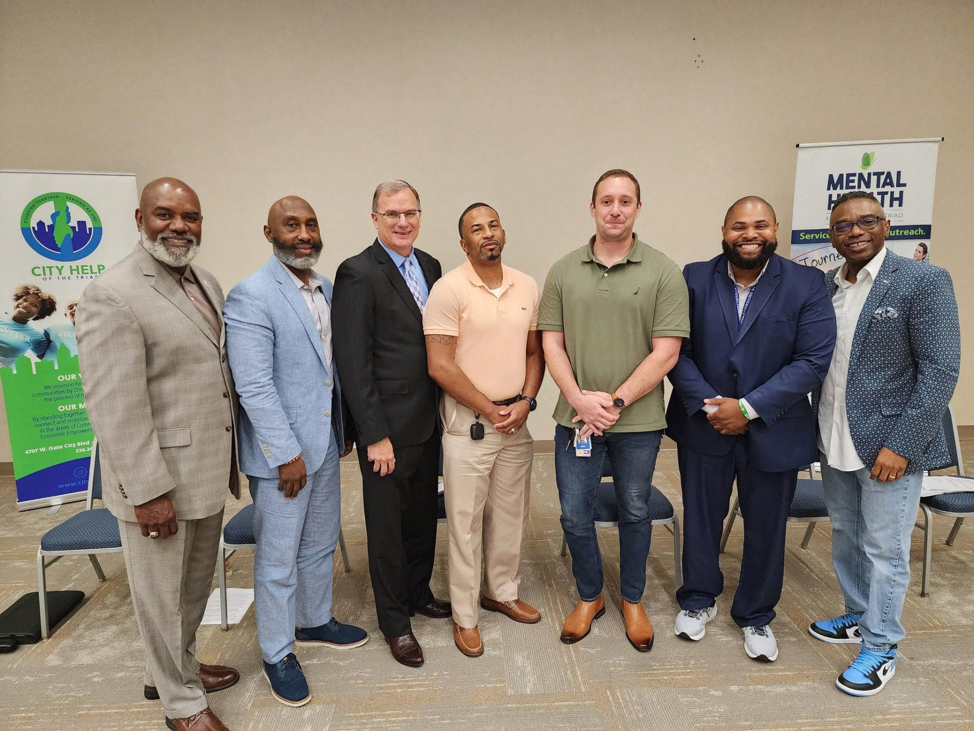 Reggie Holiday with fellow panelists at a City Help of the Triad and Mental Health Triad community panel.